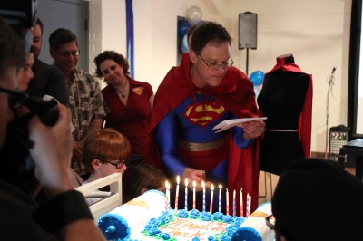 Superman lighting his candles