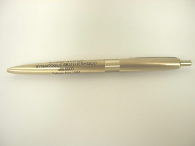 One of three pens from the Rogers Avenue Synagogue Brotherhood,  Fathers Day, 1984. Gold colored metal, ball points.  Courtesy of Morris Cohen. 1993.52.223a.