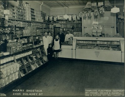 The Shostack store on Dulaney Street in Southwest Baltimore, circa 1937. Back row: Harry and Mary Shostack, Mary’s father Wolf Kotzen, and store employee Carl Warfield. Front row: Debby and Harriet Shostack.