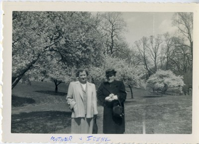 1985.046.003 – Two women standing in front of cherry blossoms in Druid Hill Park, 1953 with the inscription “mother and Irene”
