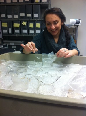 Intern Molly works to mend glass oil lamp chimneys.