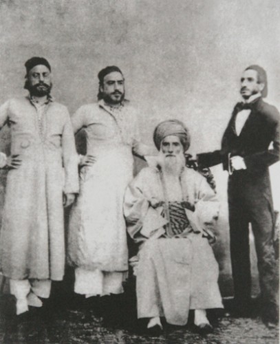 David Sassoon (seated) and his sons Elias David, Albert (Abdallah) & Sassoon David. Image via wikipedia.