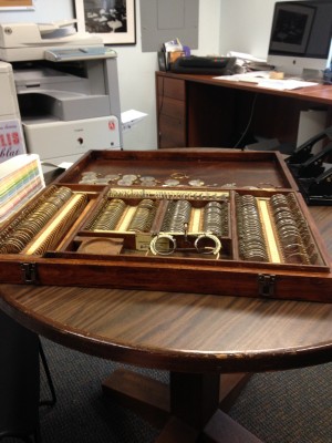 “Intern Wrangler” and Senior Collections Manager Jobi taught all the interns how to handle collections items. I was fortunate enough to be able to work with this artifact – an eye glass case used by Optometrists back in the day – and prepare it for display.