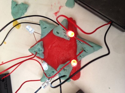 An example I made for students during an activity connected to the Electrified Pickle exhibit.  The students loved playing with the play dough and LED lights – plus they learned about conductive and insulating electricity!