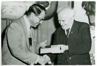 reenstein receiving a book from Prime Minister, David Ben Gurion, 1949. JMM 1971.20.192