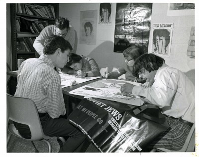 ”Soviet Jews protest their oppression demand their freedom let my people go.” A group of young men working on protest posters at the JCC, January 1973. Photo by Sussman Photography, JMM 2006.13.1553.
