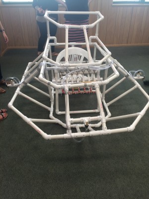 This is a project that was completed at a STEM summer camp for blind high school students. Students worked together to solve a problem—in this case, an asteroid plummeting toward Earth—and built this solution, some sort of spacecraft.