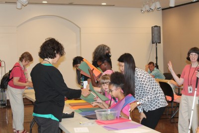Museum staff assist BELL campers during art activity.