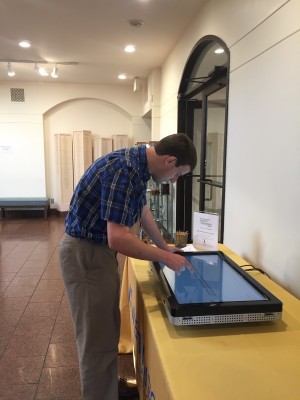 Visitor Services Coordinator, Graham Humphrey, tests the new computer activity.