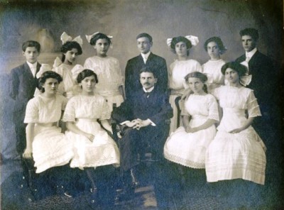 The Har Sinai confirmation class of 1911. (The book’s protagonist is glad to learn that the Rosenbach family’s laundry is sent out, so she won’t have to do more than iron; take a look at these nice white dresses and you’ll understand her relief!) Donated by Audrey Fox. JMM 1994.189.1