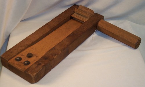 Large wooden gragger (noisemaker for Purim), made from solid wood pieces, c. 1900. This gragger was found in the basement of a Highlandtown rowhouse on Fairmont Ave. JMM 1999.162.1