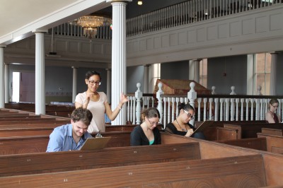 Facilitator Christen Chiosi works with three of our summer interns in the Lloyd Street Synagogue during the August workshop.