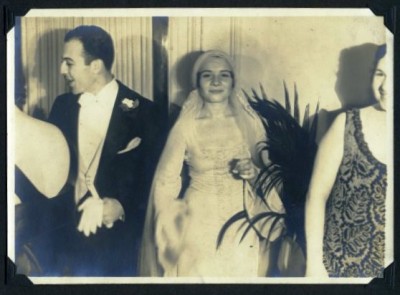 Florence smiles at the photographer while Howard greets a guest, 1932. Anonymous gift. JMM 1998.47.4.62