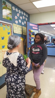 Natalie speaks with a student about her role as Henrietta