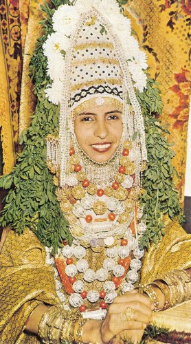 A bride in traditional Yemenite Jewish bridal vestment, in Israel 1958. Photo by Ba'Asor Le'Israel. Masada Publishing, Jerusalem, 1958. Via.