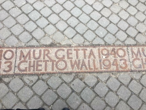 Placard of the Warsaw Ghetto. These stone inserts cover the extent of the wall and are all that remain to tell people where the Ghetto once stood.