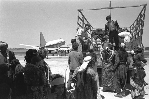 Immigrants from Iraq leaving Lod airport on their way to ma'abara, 1951. Via.