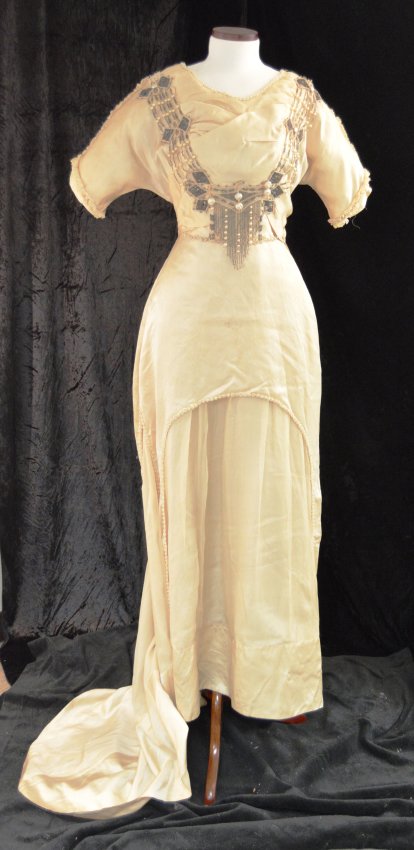 Wedding dress made of silk with beadwork on bodice and skirt, worn by Bessie Grossman when she married Louis Paymer, Jan. 3, 1911. Gift of Zelda Paymer Salkin and Lenore Paymer Snyder. JMM 1986.109.1