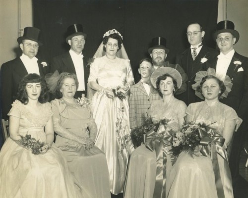 The bride and groom with their families and wedding party: the wedding of Rabbi Meyer Zywica and Frances Friedlander, June 11, 1950. Seated, left to right: Elaine Friedlander, Rebbitzen Rose Friedlander, Rebbitzen Esther Friedlander Rosenblatt, Hinda Feldman Esterson. Standing, left to right: Rabbi Yonah Weisbord, Rabbi Meyer Zwyica, Frances Friedlander, Jason Rosenblatt, Rabbi E.B. Friedlander, Rabbi Morris D. Rosenblatt, Professor Morton Esterson. Gift of Morton M. Esterson. JMM 1993.109.1