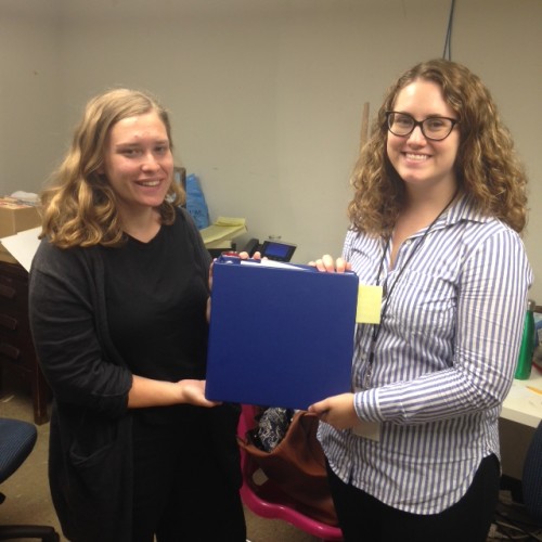 Joelle and Amy with the all-powerful traveling exhibit binder!