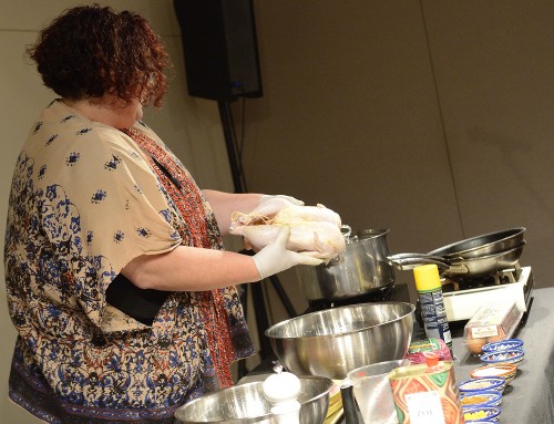 Vered shows off the ideal chicken at the Feast of Flavors cooking demo.