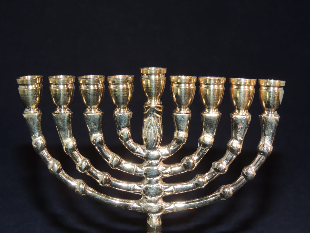 Brass menorah with nine branches.