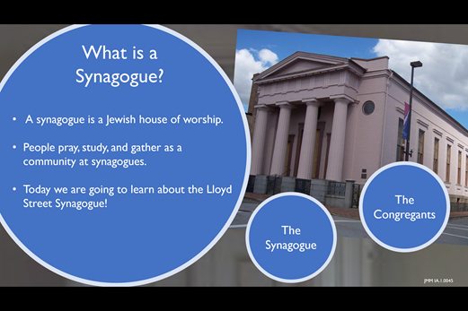 A slide from the Immigrant Experience program. The slide describes the role of synagogues in Jewish communities and introduces the Lloyd Street Synagogue.