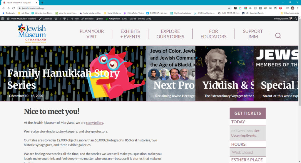 Color screenshot of the JMM website homepage showing the top navigation bar, a colorful image banner and text.