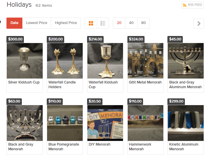 Screenshot of the "Holidays" category page of the online museum shop showing a grid of merchandise options like kiddush cups, candle holders, and menorahs.