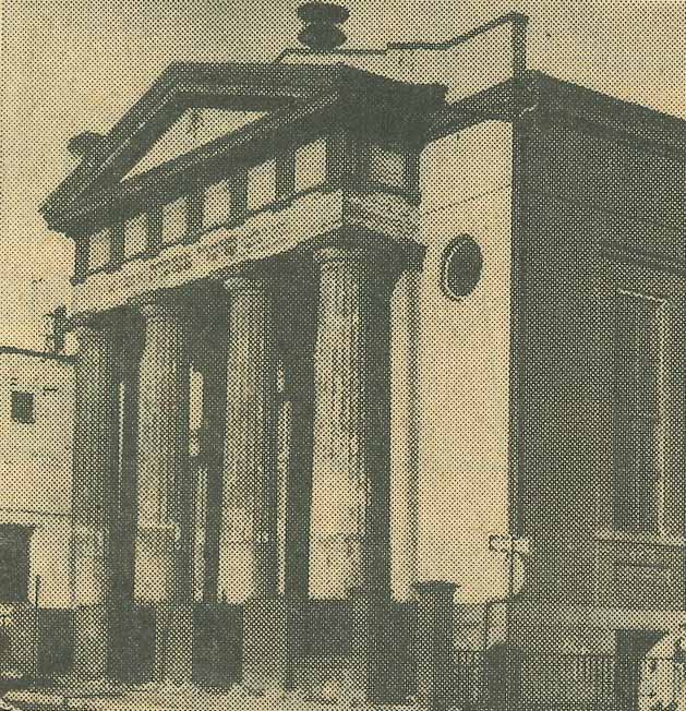 An exterior photo of the Lloyd Street Synagogue, a large building with columns and a pointed top.