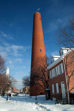The Shot Tower, a very tall, cylindrical, brick building.